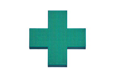 Green cross of a pharmacy store on the wall of a building, isolated on a white background