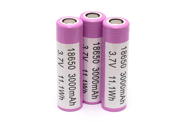 Three pink lithium batteries isolated on a white background with an inscription pasted on them...