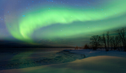 Fototapeta na wymiar Northern lights or Aurora borealis in the sky over Tromso fjords - Tromso, Norway