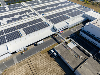 Naklejka premium solar panels on factory rooftop