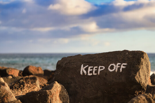 Danger Ahead: Keep Off Beyond the Boulder sign