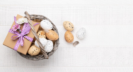 Gift box with flowers and Easter eggs basket