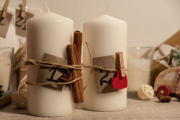 Candle with advent calendar Traditional Burning Christmas Wax Candles with numbers counting down for Christmas. Beautiful Advent At Home. Festive Candlelight And Dark Background