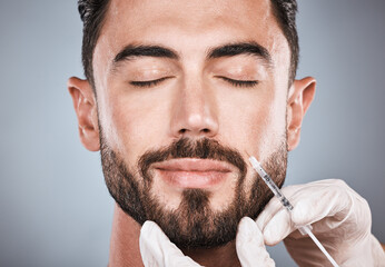 Needle, man and plastic surgery for skincare, collagen and beauty clinic in studio. Botox...