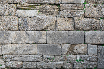 close up of the walls made of stone , stone background.