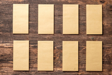 top view of group of yellow notepad align on wood table