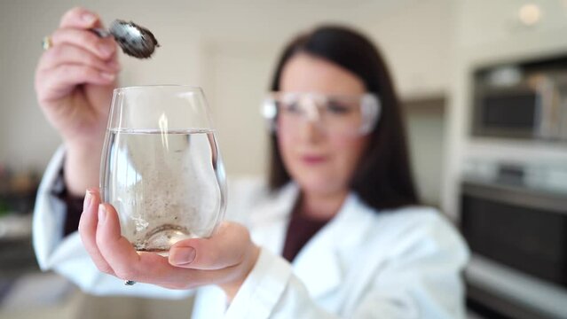 Soil test, female agricultural scientist conducting a soil test in a scientific lab in. soil agricultural agronomist in australia