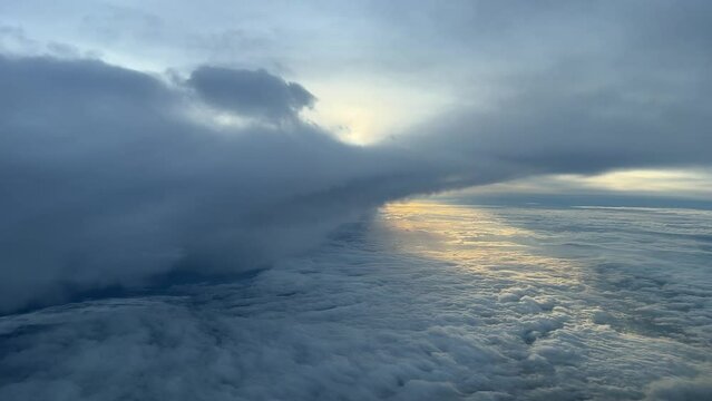 Aerial view from a  jet cockpit of a stormy sky recorded just after dawn. PIlot point of view.