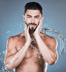 Water splash, face and shower with man in portrait for beauty and skincare isolated on studio...
