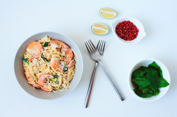 tasty healthy vegetarian dish - italian creamy basil shrimp pasta with pink pepper and lime