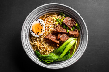 Ramen Asian noodles soup with beef - obrazy, fototapety, plakaty