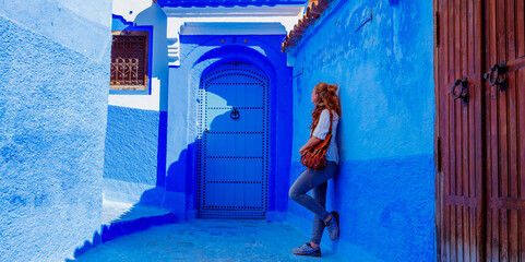 Woman visiting Chefchaouen city in Morocco