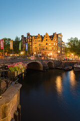 Fototapeta premium Amsterdam Canals with bridge and Traditional Dutch houses, Netherlands