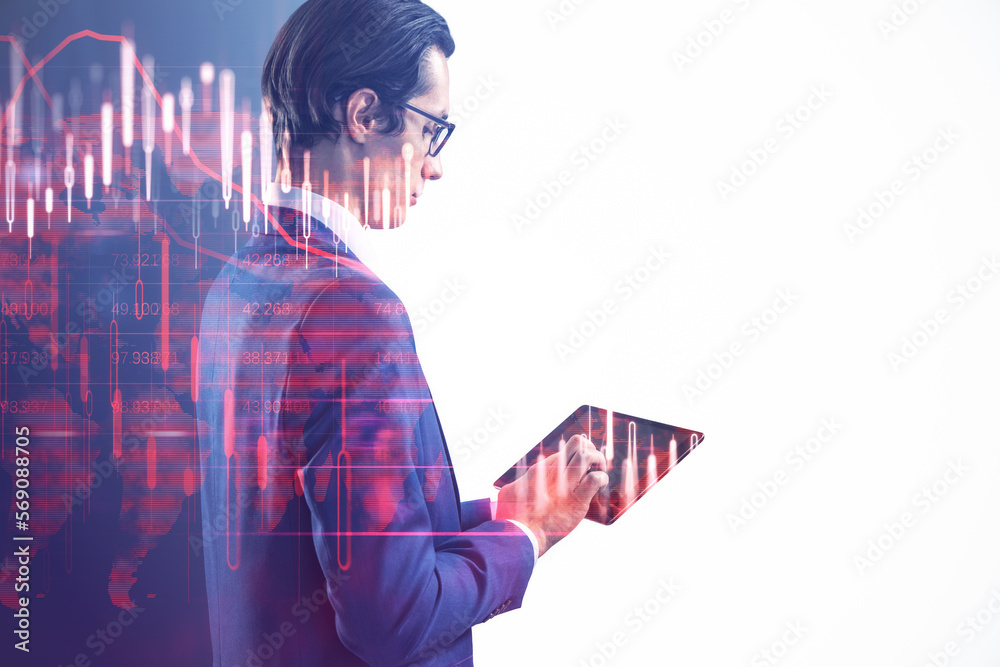 Poster attractive young european businessman using tablet with glowing falling red forex chart on blurry wh
