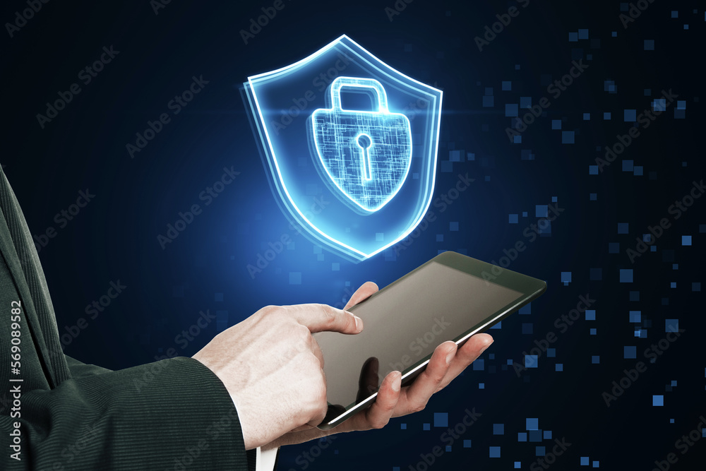 Poster close up of businessman pointing at tablet with glowing padlock hologram on dark blurry background. 