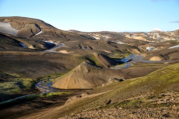 Landmannalaugar, Iceland, Europe. View of the stunning Rainbow mountains in Iceland. A colorful highland tour. Colorful mountains 
partially covered with snow. 