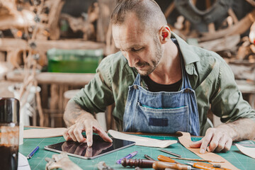 modern artist using tablet computer for helping design sale product and marketing contacts customer