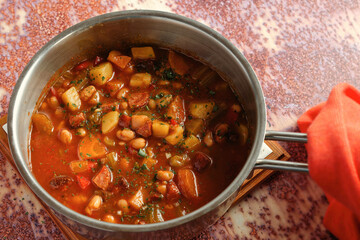 Bean soup with white beans, potatoes, vegetables and sausage