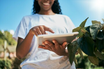 Black woman, hands and tablet with smile for agriculture, eco friendly or sustainability at farm....