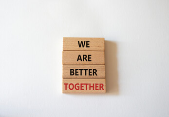We are stronger together symbol. Wooden blocks with words We are stronger together. Beautiful white background. We are stronger together concept. Copy space.