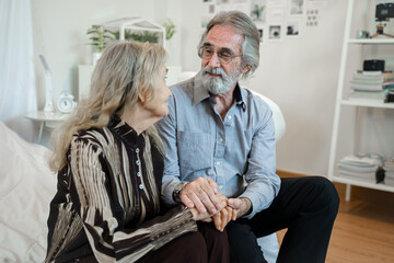 Fototapeta premium Senior husband and wife holding hands to encourage,eternal love, trustworthy harmonic relations between older spouses concept.