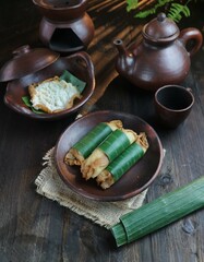 serving of rolled pancakes on a clay plate