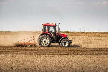 Fields of possibility, tractor readying the earth for a bountiful harvest