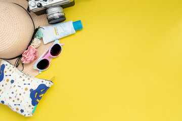 Composition with beach accessories and space for text on yellow background. Summer vacation, holiday, trip and travel concept. Flat lay, banner design 