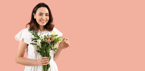 Beautiful happy young woman with bouquet of alstroemeria flowers on pink background with space for text