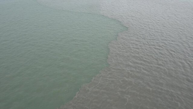 Estuary difference between fresh water and sea water from above