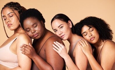 Obraz premium Hug, diversity and portrait of women in underwear for sleep isolated on a studio background. Friends, embrace and models with body positivity, lingerie and confidence in a collaboration on a backdrop