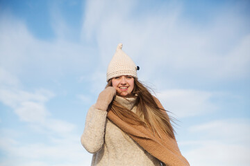 portrait of a cheerful woman with ice skates on a frozen lake  in winter nature. Enjoying the little things. Winter Vibes. christmas holiday