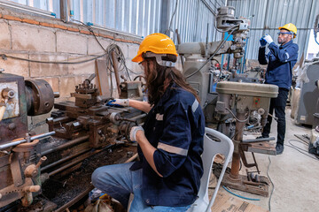 In robotic maintenance repair engineer lathe machine fabricate part and vernier caliper measuring