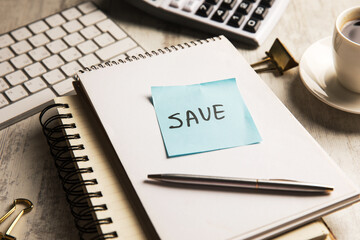 Save is written on paper.