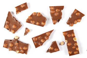 Chocolate bars set with hazelnut, pieces isolated on white background, top view