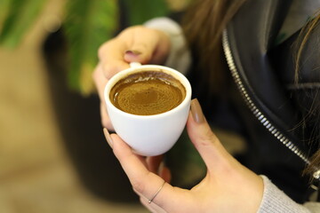 person holding a cup of coffee