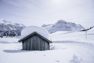 Alpine Hut in a scenic mountain landscape in winter