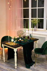 Romantic dinner table setting with festive lights