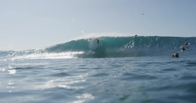 Slow Motion Tracking A Man Surfer As He Catches A Wave And Falls (Shot On Red) - Oahu, Hawaii