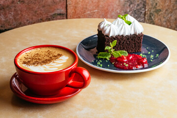 chocolate dessert with buttercream and coffee in a cup