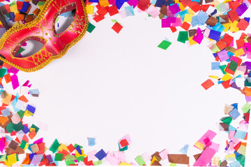 Colorful confetti frame with venetian read mask on white background
