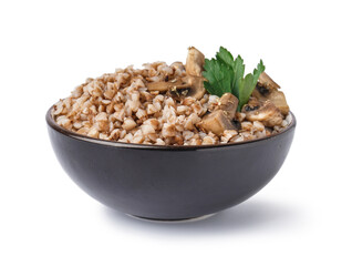 Bowl of tasty buckwheat porridge with mushrooms and parsley on white background