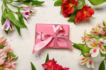 Composition with beautiful alstroemeria flowers and gift for Women's Day celebration on white background