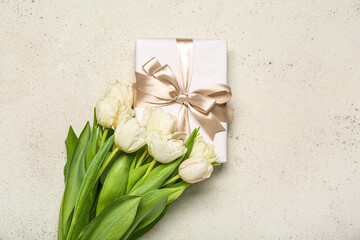 Beautiful tulip flowers and gift for Women's Day celebration on white background
