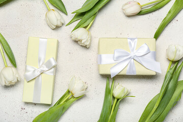 Fototapeta na wymiar Beautiful tulip flowers and gifts for Women's Day celebration on white background
