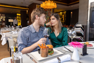 Romantic couple having lunch in the restaurant