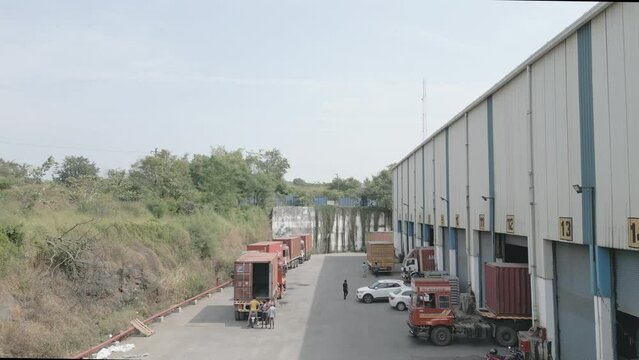 Trucks being loaded at warehouse in Mumbai India