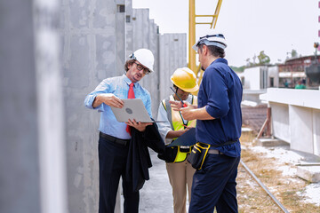 Site manager walk down with engineer to check precast ready made concrete panel work progress