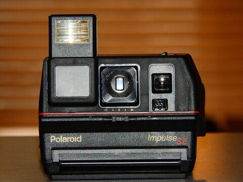Vintage early 1990s Polaroid Impulse SE camera, Moscow, Russia - November 14, 2018