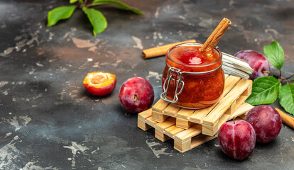 Sweet homemade plum jam on a dark background. place for text, top view
